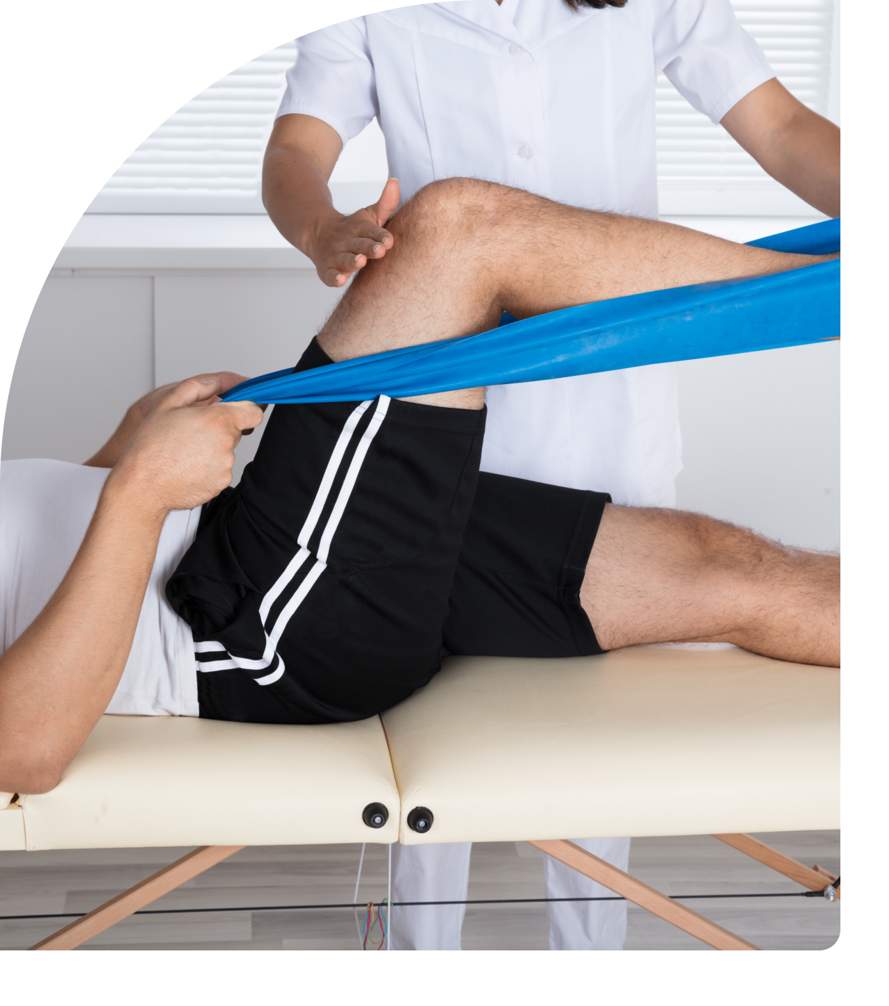 Physical therapy session with resistance band.