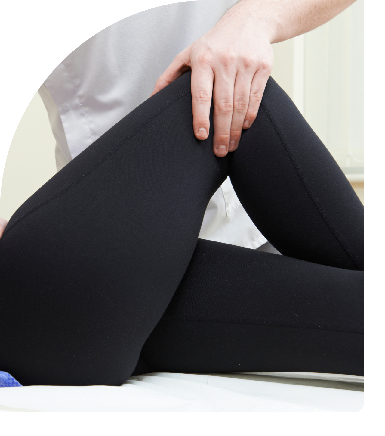 Person receiving physical therapy leg treatment.