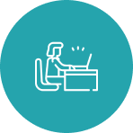 Person working on laptop icon.
